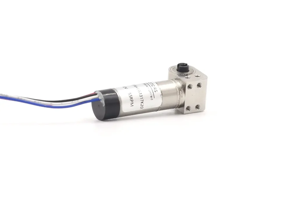 Micro DC Servo Motor TSL-PG10K28 shown with a scale for size comparison