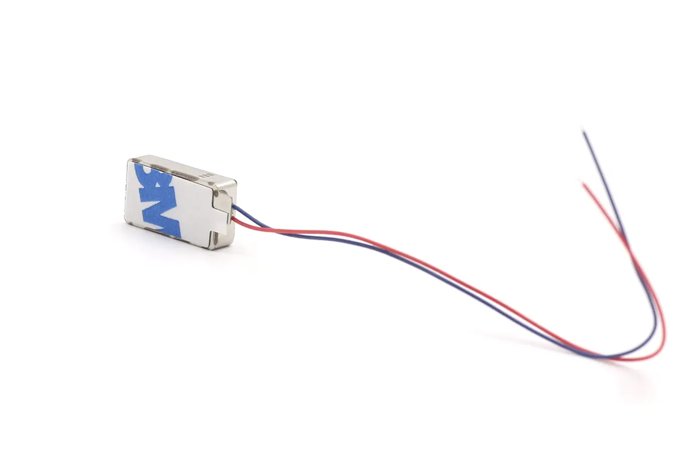 Bottom view of the haptic feedback actuator featuring pre-applied 3M double-sided adhesive tape for secure mounting.
