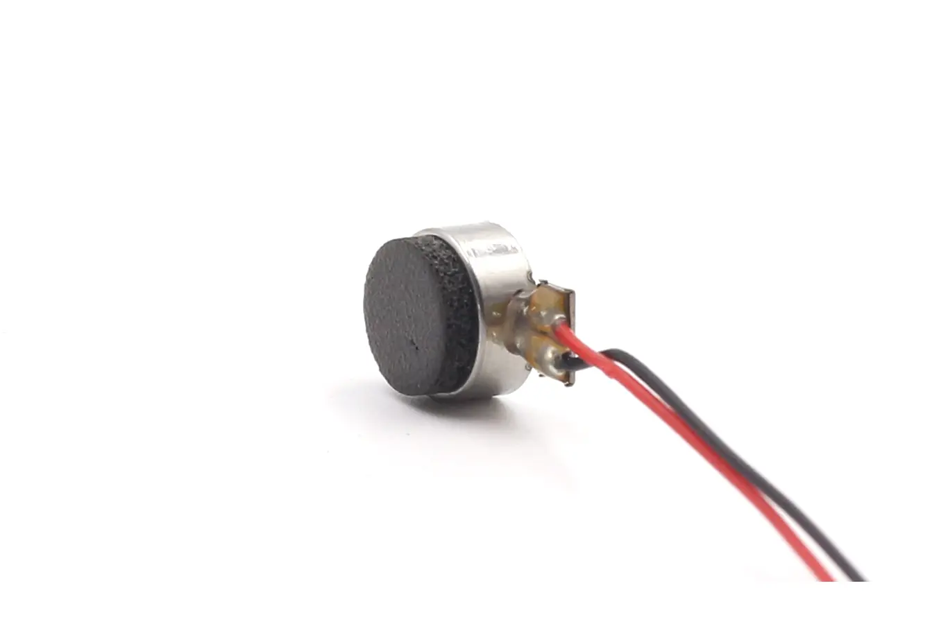 Reinforced UV glue wire solder joints on a 10mm haptic feedback motor.